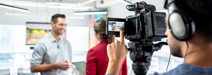 videographer creating a Professional video with 2 business people.